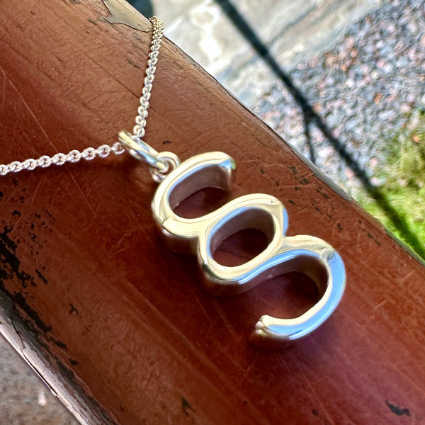 Pykälämerkki - hopea riipus