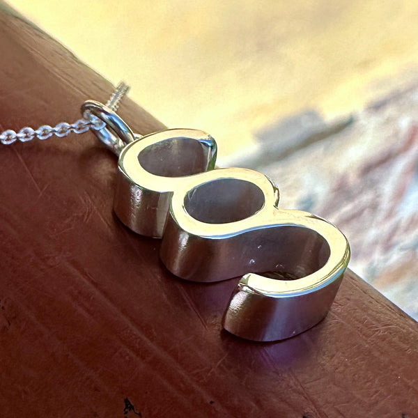 Pykälämerkki - hopea riipus